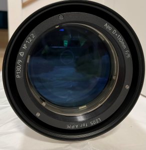 Photograph shows the deep blue anti-reflection coatings on the finely made triplet lens.